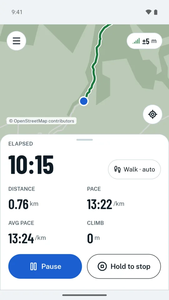 Recording a walk: the live map with the track so far, the elapsed time, distance, pace, average pace and climb, and the Pause and Hold to stop buttons.